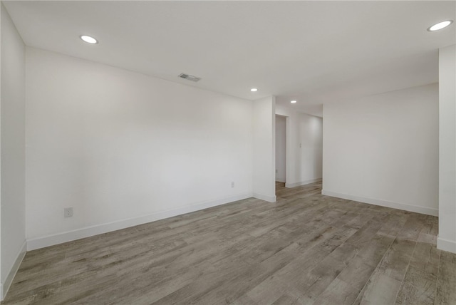 spare room featuring light hardwood / wood-style flooring