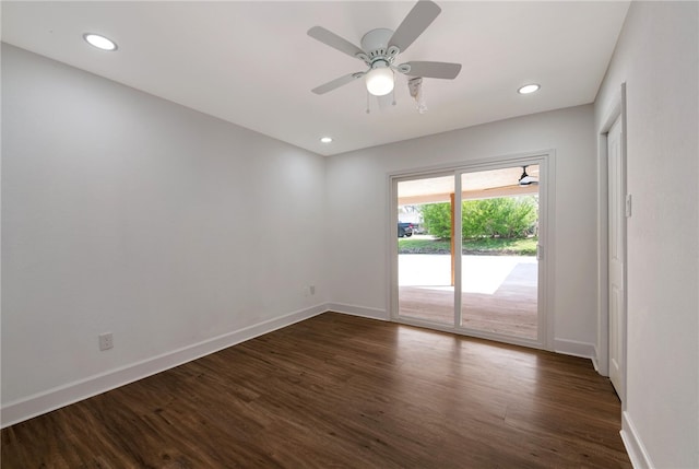 unfurnished room with ceiling fan and dark wood-type flooring