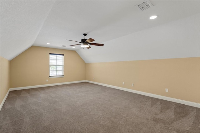 additional living space with carpet floors, ceiling fan, and lofted ceiling