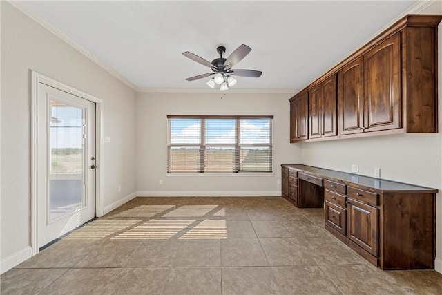 kitchen with crown molding, built in desk, dark brown cabinets, and ceiling fan