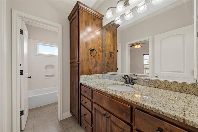 bathroom featuring ceiling fan, tile patterned flooring, ornamental molding, tub / shower combination, and vanity