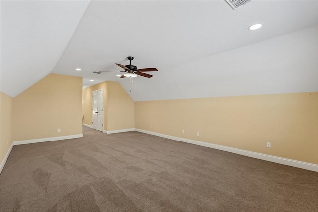 bonus room with vaulted ceiling, ceiling fan, and carpet