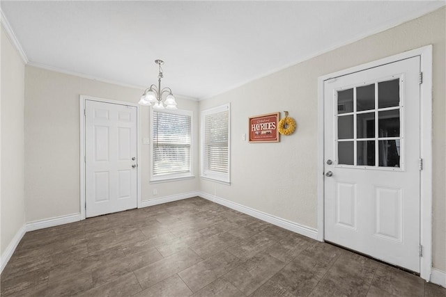 unfurnished dining area featuring baseboards, crown molding, and an inviting chandelier