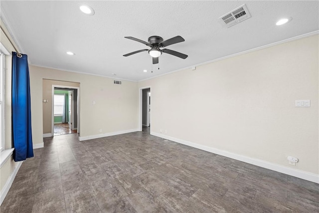 spare room with crown molding, recessed lighting, visible vents, ceiling fan, and baseboards