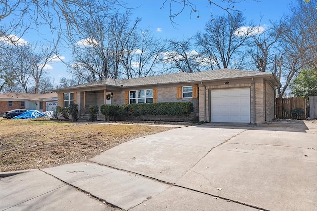 ranch-style house featuring a garage, driveway, fence, and brick siding