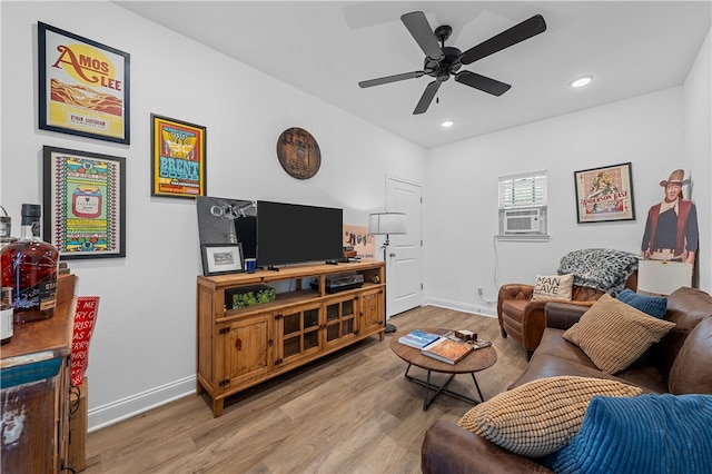 living area with a ceiling fan, recessed lighting, baseboards, and wood finished floors