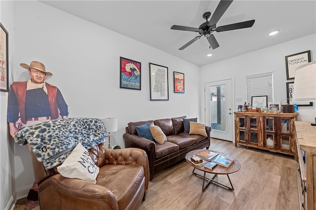 living room featuring a ceiling fan, recessed lighting, and light wood-style flooring