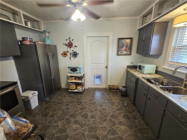 kitchen with a ceiling fan, open shelves, a sink, light countertops, and appliances with stainless steel finishes