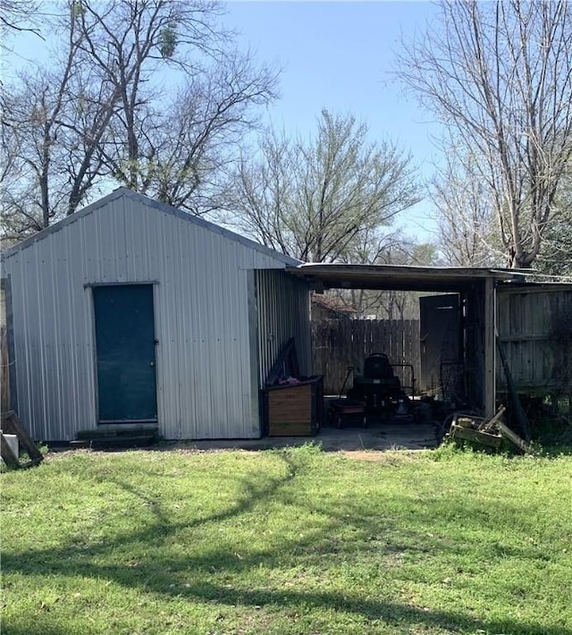 view of outbuilding featuring an outbuilding and a carport