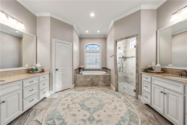 bathroom featuring plus walk in shower, ornamental molding, and vanity