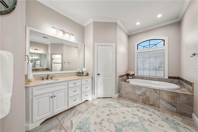 bathroom featuring vanity, a relaxing tiled tub, and ornamental molding