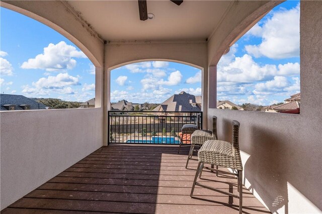 wooden terrace featuring ceiling fan