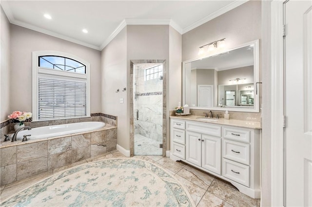 bathroom with separate shower and tub, vanity, and ornamental molding