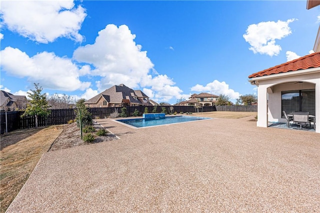 view of swimming pool with a patio area