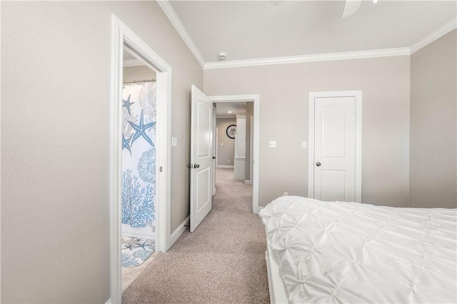 carpeted bedroom featuring ceiling fan and crown molding