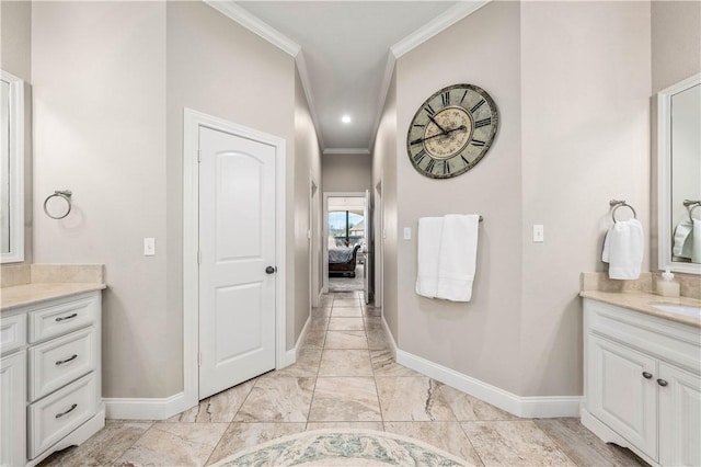 bathroom with vanity and ornamental molding