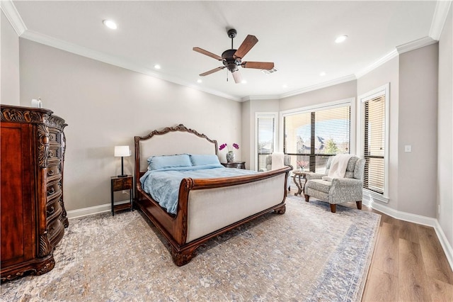 bedroom with ceiling fan, light wood-type flooring, and crown molding