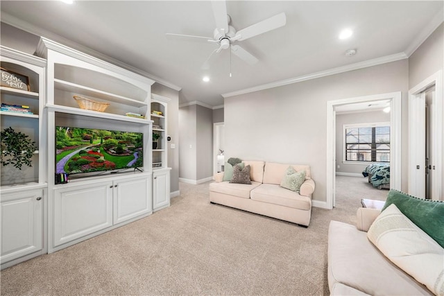 living room featuring ceiling fan, light colored carpet, and ornamental molding