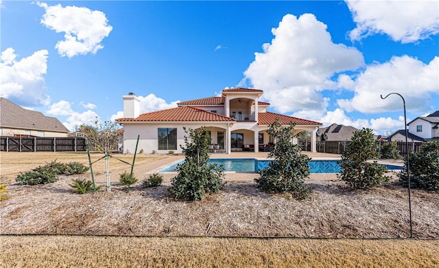 view of swimming pool with a yard and a patio