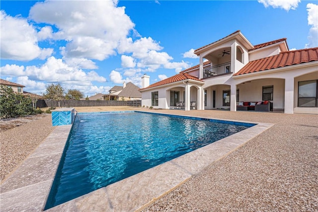 view of pool featuring ceiling fan, a patio area, and an outdoor hangout area