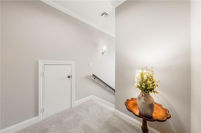 staircase featuring ornamental molding, carpet flooring, and a baseboard radiator