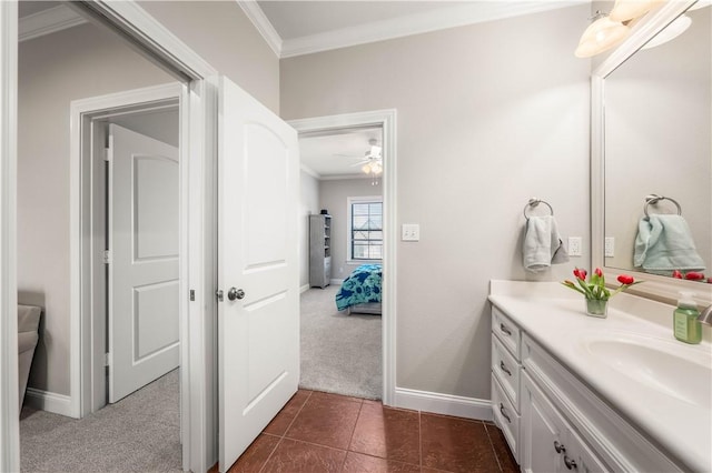 bathroom with ceiling fan, vanity, crown molding, and tile patterned flooring