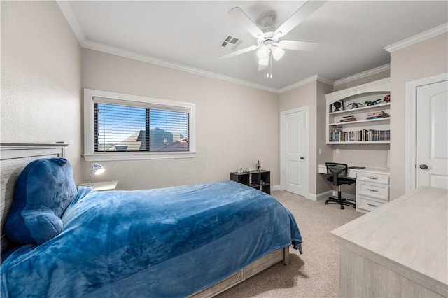 carpeted bedroom featuring ceiling fan and crown molding