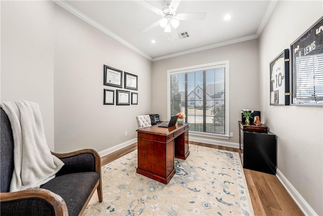 office with ceiling fan, crown molding, and light wood-type flooring