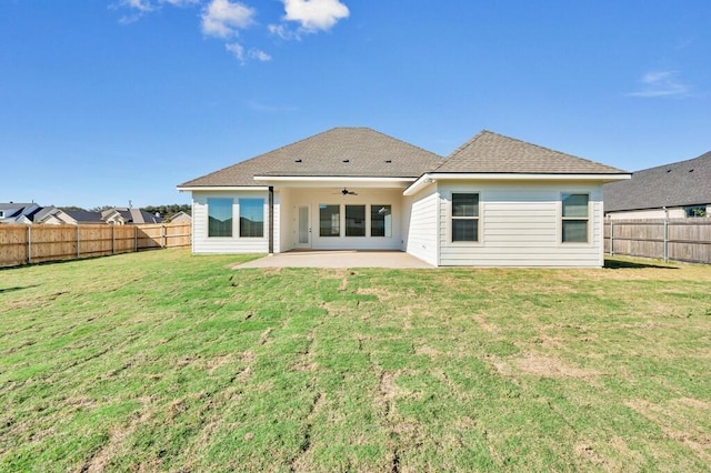 rear view of house featuring a lawn, a patio area, and ceiling fan