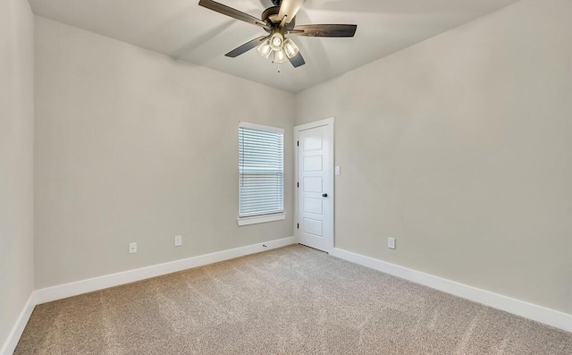 empty room with ceiling fan and light carpet