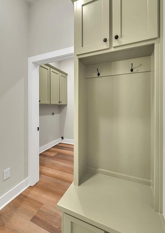 mudroom with light hardwood / wood-style floors