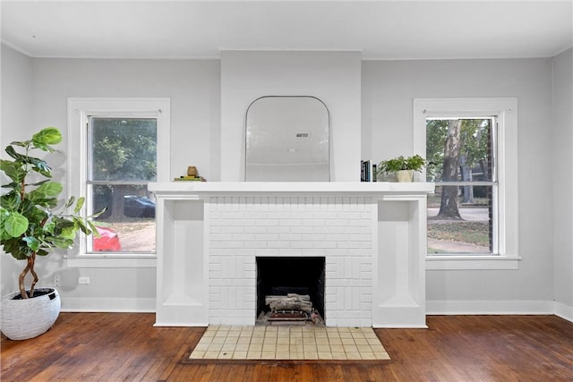 interior details with hardwood / wood-style flooring and a fireplace