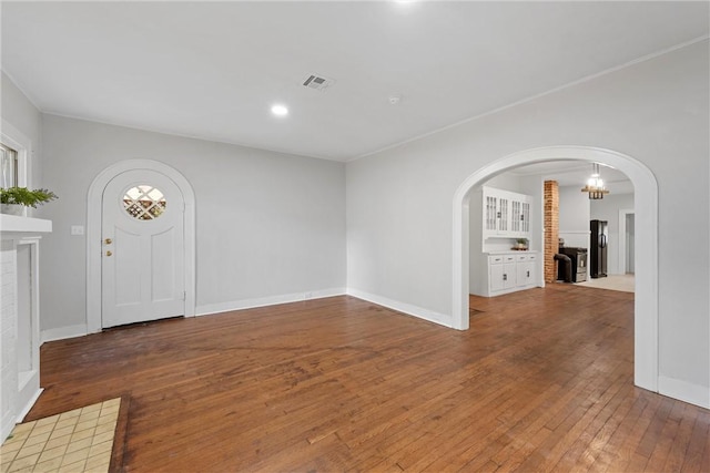 foyer entrance featuring hardwood / wood-style floors