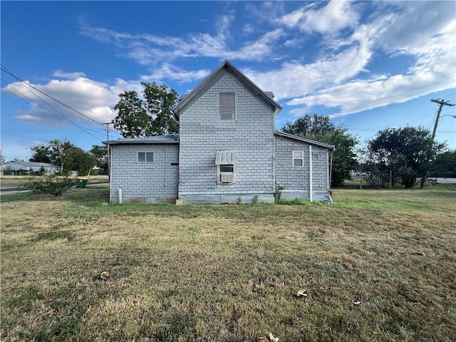 rear view of house with a lawn