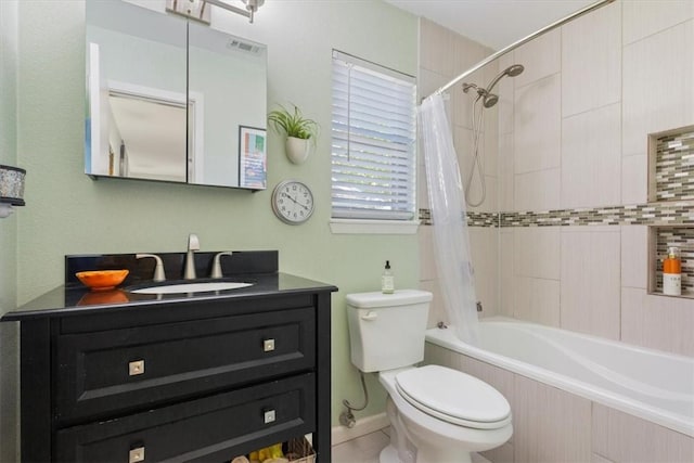 full bathroom featuring vanity, toilet, and shower / bathtub combination with curtain