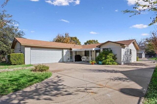 single story home featuring a garage