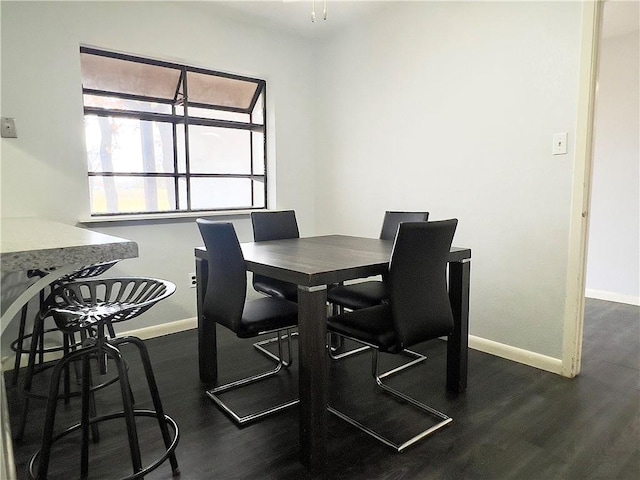 dining space featuring dark hardwood / wood-style flooring