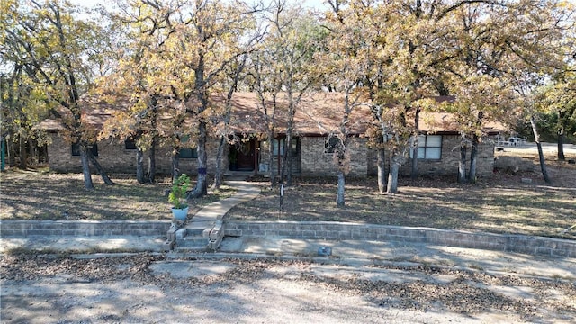 view of property hidden behind natural elements