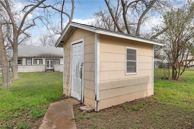 view of shed featuring fence