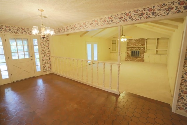 interior space featuring ceiling fan with notable chandelier, a textured ceiling, vaulted ceiling with beams, and built in features