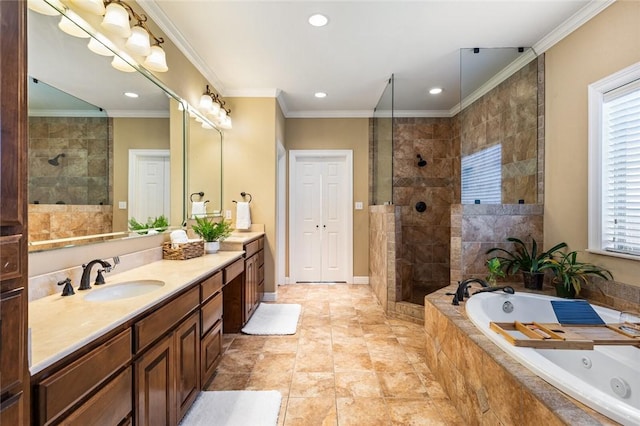 full bathroom featuring a jetted tub, vanity, walk in shower, and crown molding