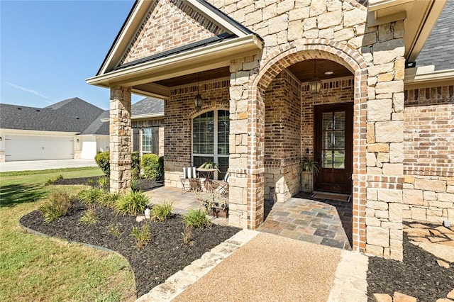 doorway to property with brick siding and stone siding