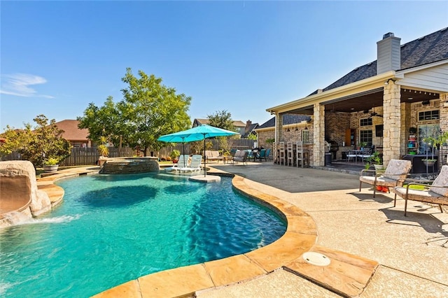 view of pool featuring a patio, outdoor dining area, a fenced backyard, and ceiling fan