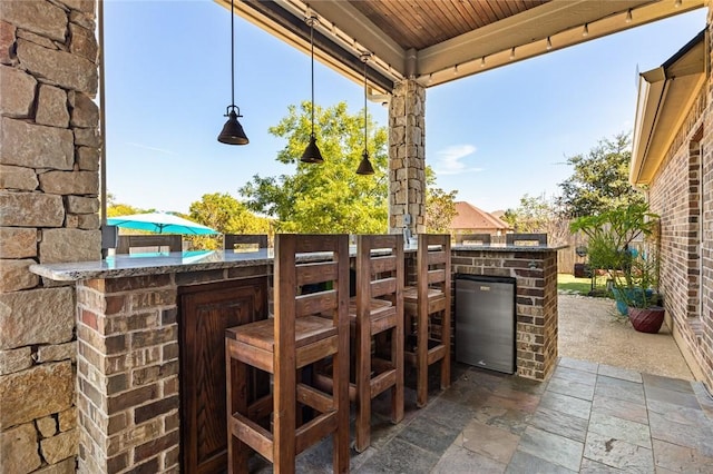 view of patio featuring outdoor dry bar