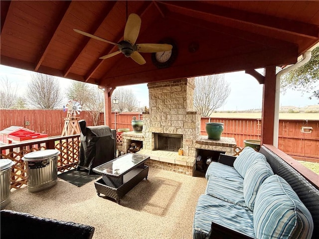 view of patio featuring area for grilling, an outdoor living space with a fireplace, a gazebo, and ceiling fan