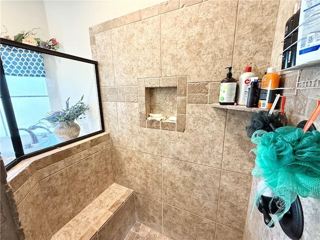 bathroom featuring a tile shower