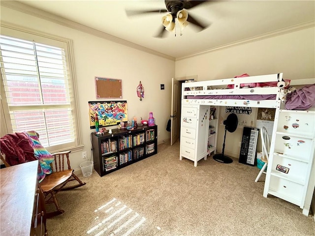 carpeted bedroom featuring ceiling fan and ornamental molding