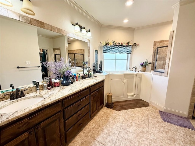 bathroom with an enclosed shower, vanity, and ornamental molding