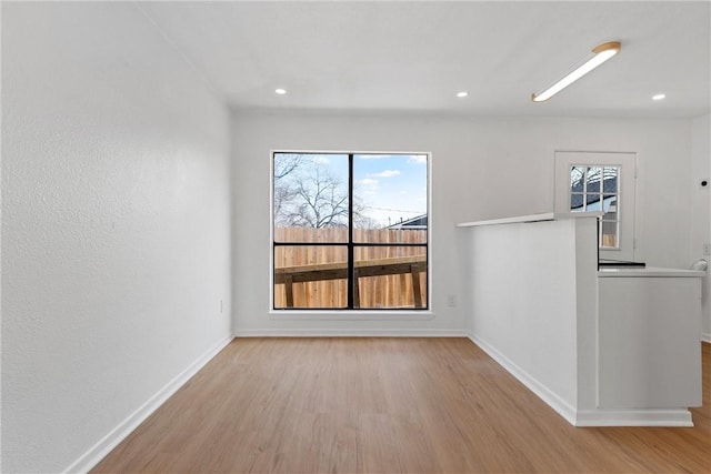 spare room with light wood-type flooring