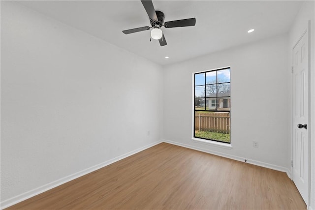 unfurnished room with ceiling fan and light hardwood / wood-style flooring